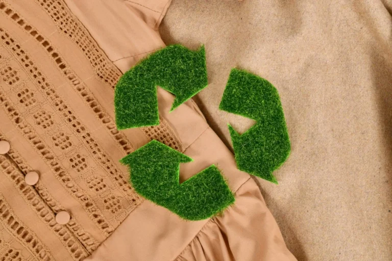 Green recycling symbol representing eco-friendly fashion at HeyAceClub